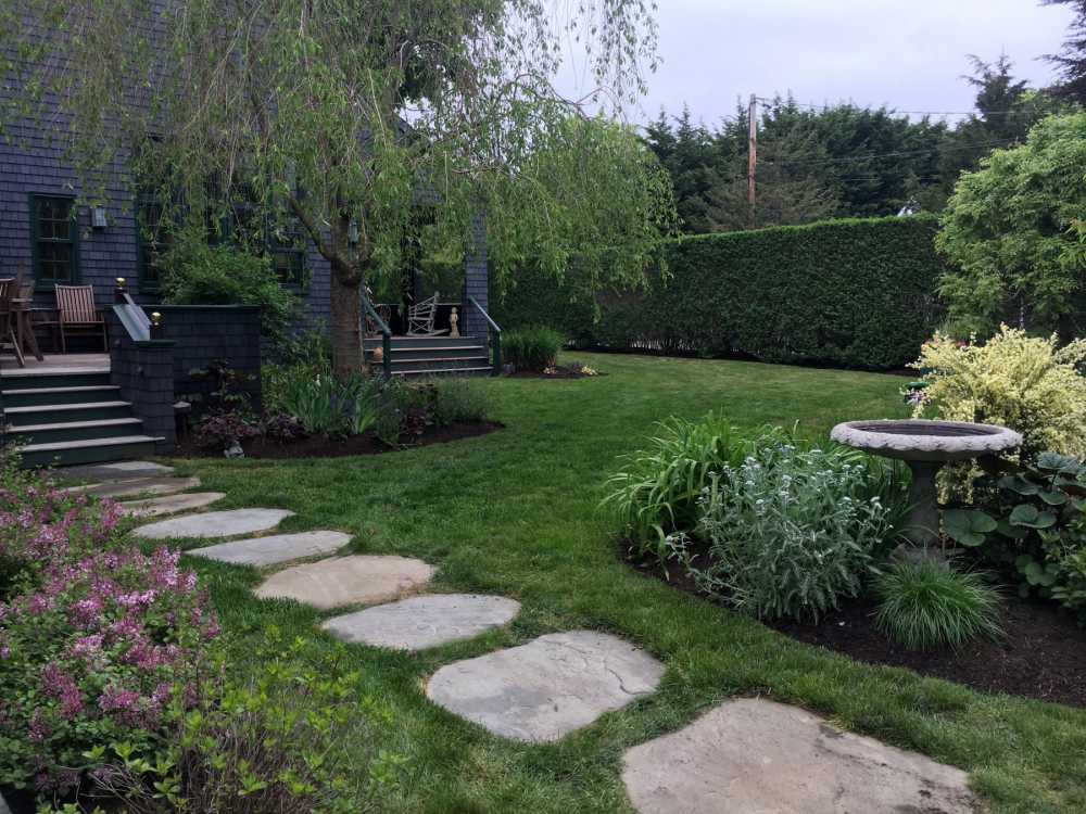 Large flagstone steppers make up this front walkway.